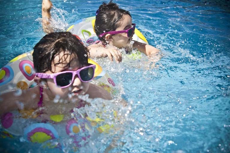 Kids swimming with sunglasses